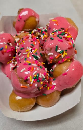 Pink sprinkle donut holes at Snowflake Donuts in Humble, TX